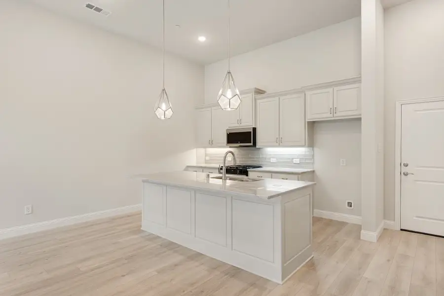 Furnished interior view inside a new home in Cottonwood Creek, Rowlett (Image 7).