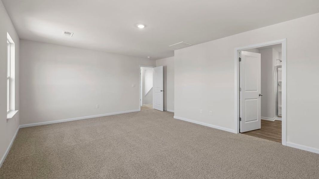 Spacious, unfurnished interior of a new home in Bentley Park, Greenwood (Image 33).