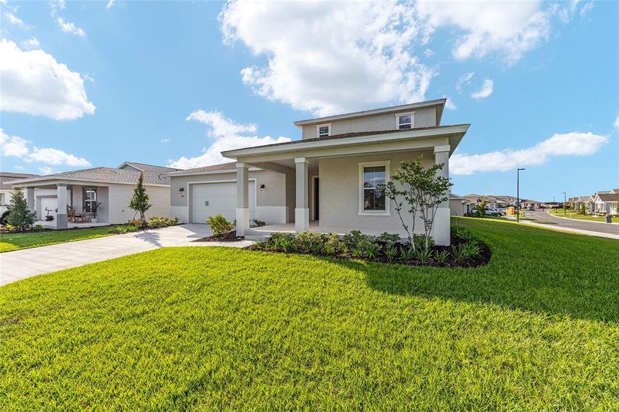 Front exterior of a new home in Calesa Township, Ocala, FL, highlighting curb appeal (Image 19).