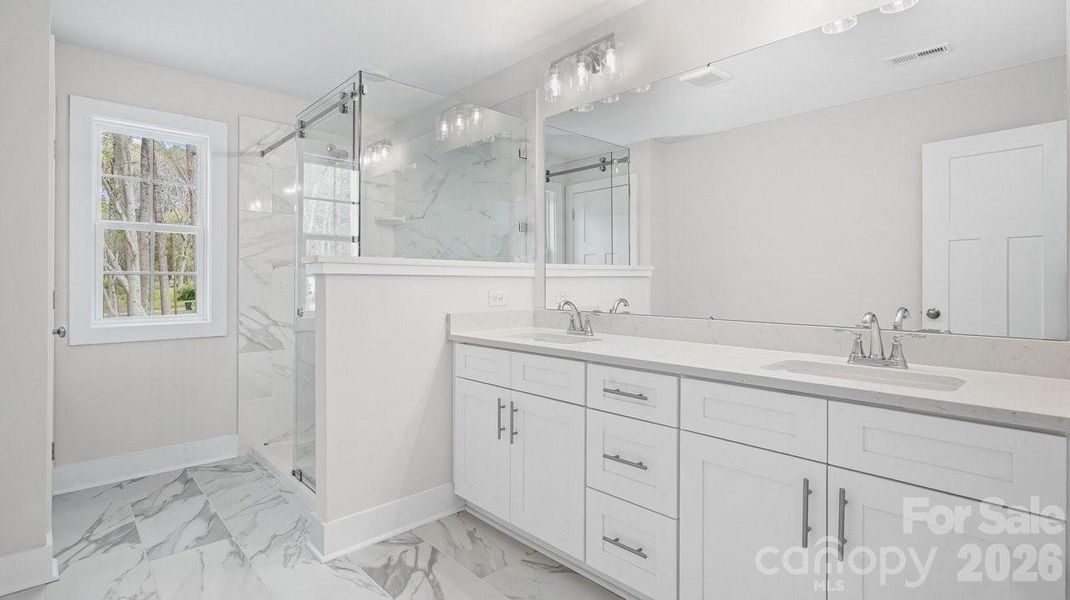Primary Bath w/Tall Vanity, Dual Sinks, Quartz Top, Beautiful Tile.