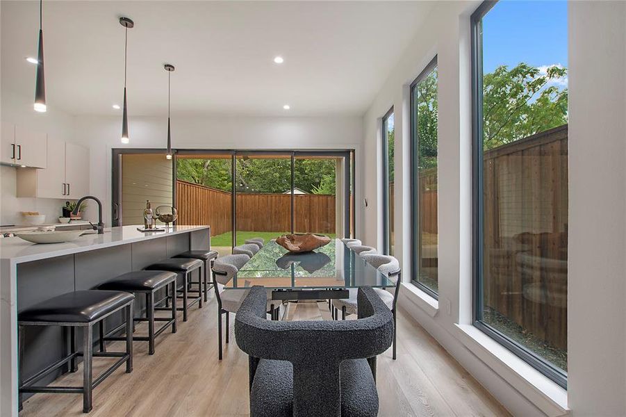 Dining room with light hardwood / wood-style floors