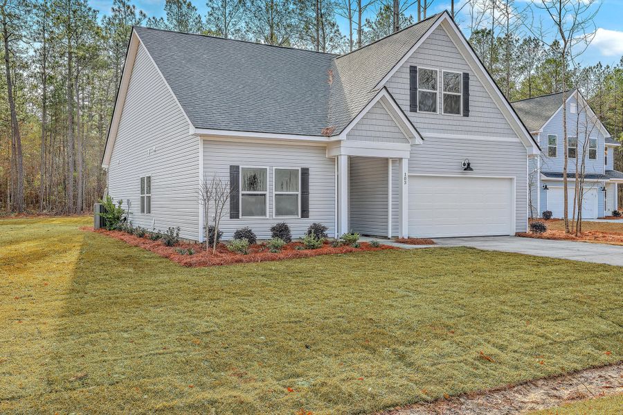 Front exterior of a new home in , Summerville, SC, highlighting curb appeal (Image 26).