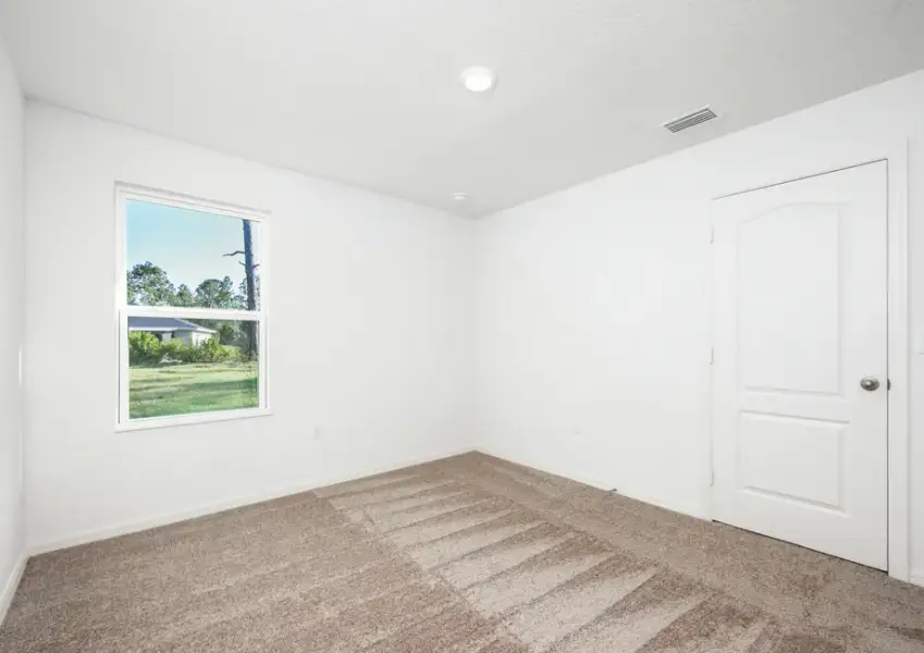 Representative unfurnished interior of a home built from the Hammock by LGI Homes in Marion Oaks, Ocala (Image 22).
