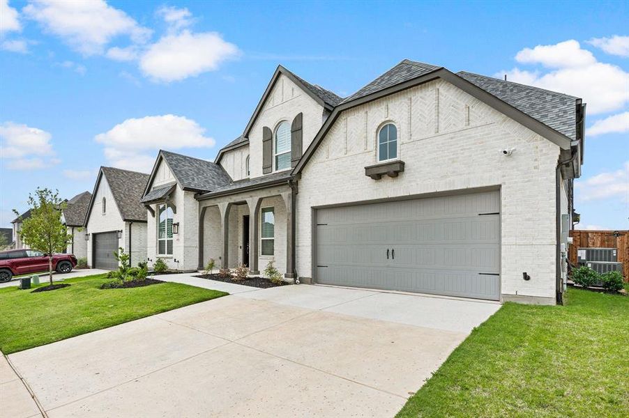 Front exterior of a new home in Wildflower Ranch, Fort Worth, TX, highlighting curb appeal (Image 26).
