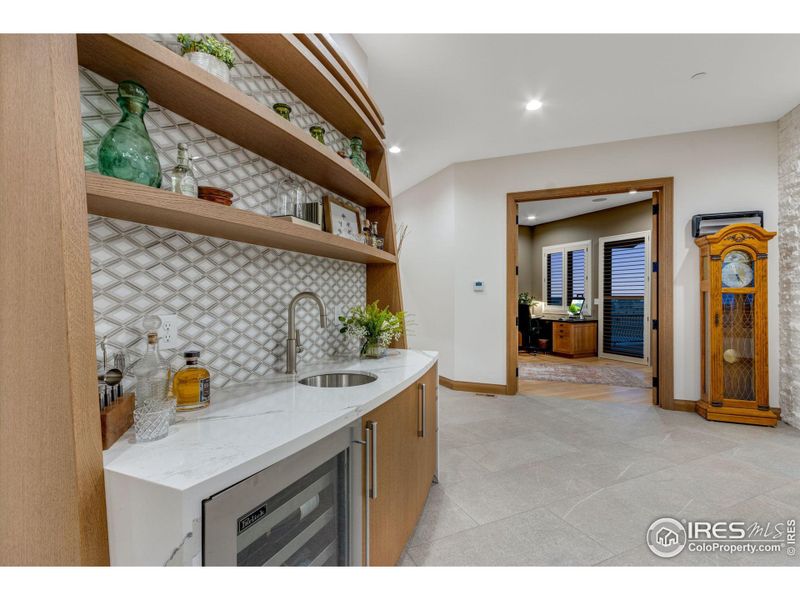 Wet bar to welcome your guests. Home also features a high end and finished elevator