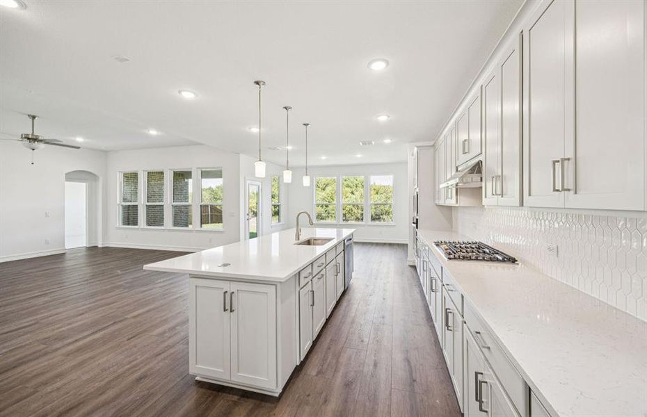 Large island overlooking gathering room and dining areas Large island overlooking gathering room and dining areas