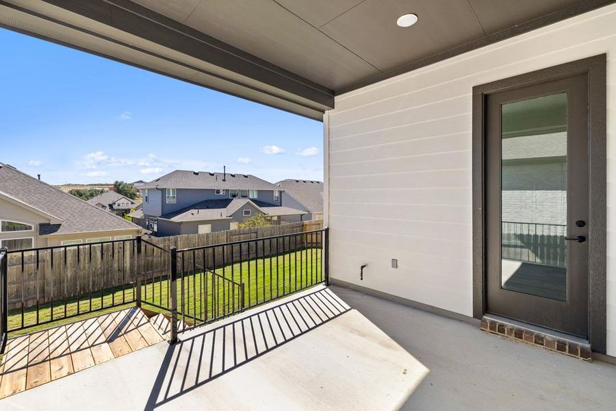 Exterior details and patio area of a home in Lariat, Liberty Hill (Image 24).