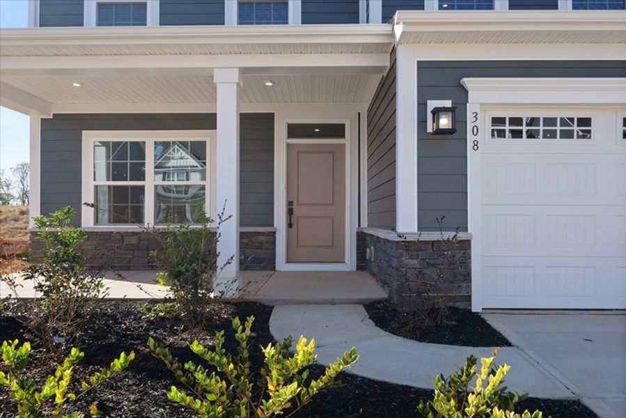 Exterior details and patio area of a home in Canterbrook Farms 2-Story, Fountain Inn (Image 2). Exterior details and patio area of a home in Canterbrook Farms 2-Story, Fountain Inn (Image 2).