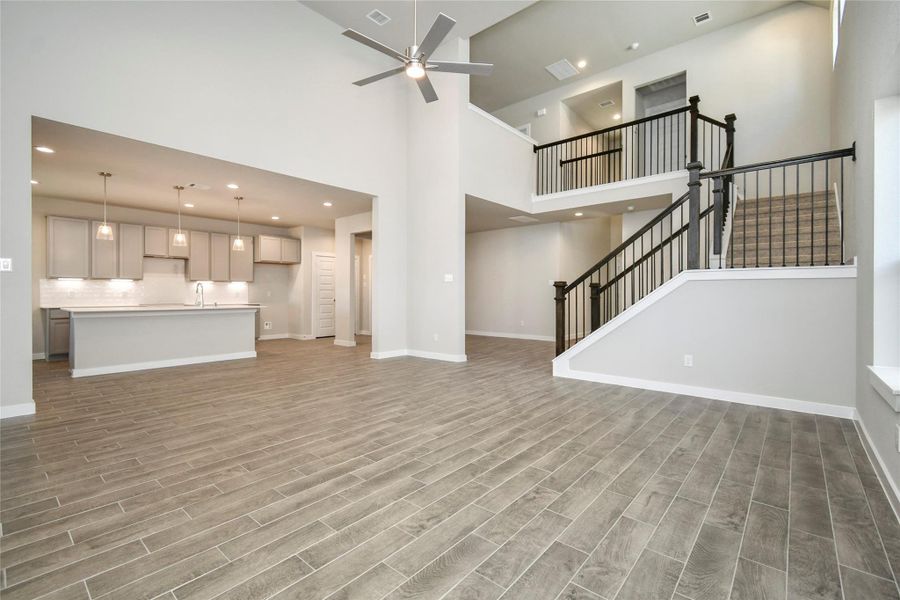 Discover another perspective of the expansive family room! Sample photo of completed home with similar floor plan. Actual colors and selections may vary.