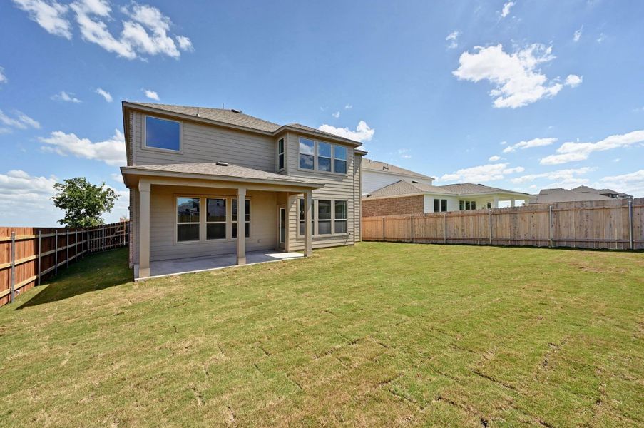 Front exterior of a new home in Salerno - Classic Collection, Round Rock, TX, highlighting curb appeal (Image 18). Front exterior of a new home in Salerno - Classic Collection, Round Rock, TX, highlighting curb appeal (Image 18).