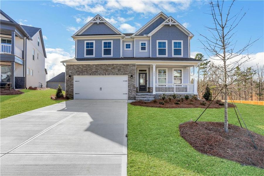 Front exterior of a new home in Cambridge, Flowery Branch, GA, highlighting curb appeal (Image 21).