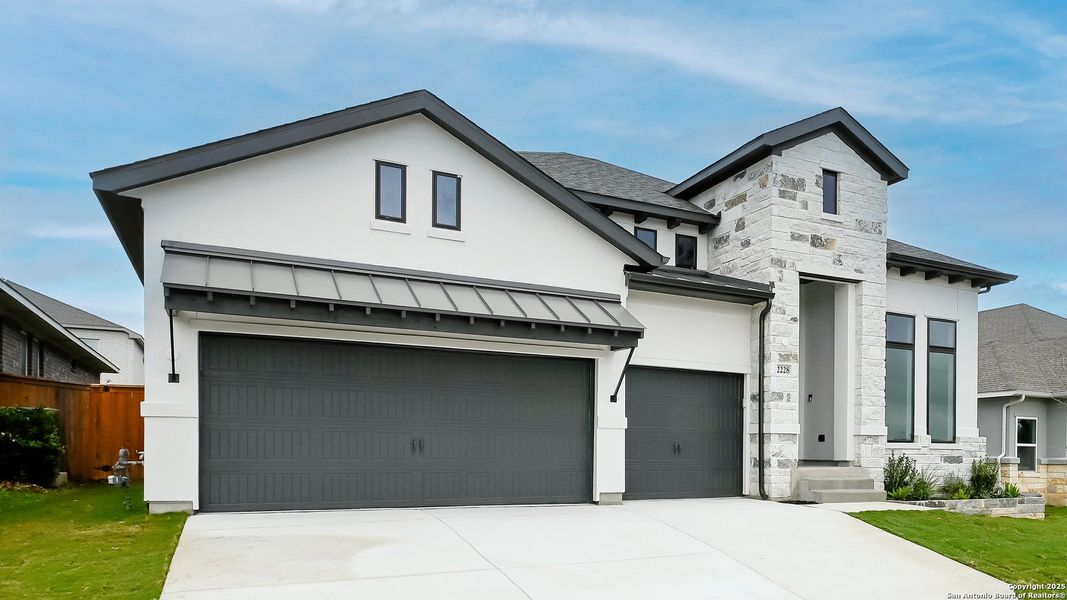 Front exterior of a new home in Veramendi 60', New Braunfels, TX, highlighting curb appeal (Image 1).