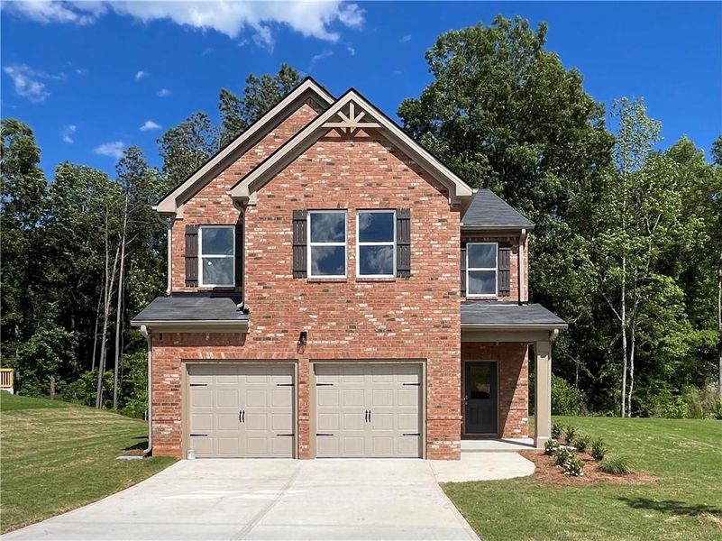 Front exterior of a new home in River Walk Farm, Covington, GA, highlighting curb appeal (Image 1). Front exterior of a new home in River Walk Farm, Covington, GA, highlighting curb appeal (Image 1).