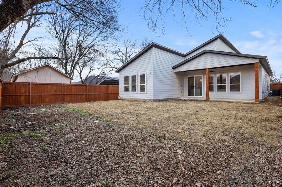 Back of house featuring cooling unit and ceiling fan