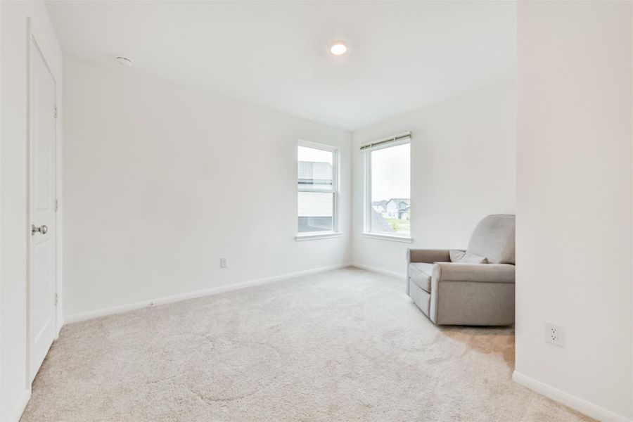 Bedroom #4 is bright and cozy featuring neutral carpeting, two large windows for natural light.