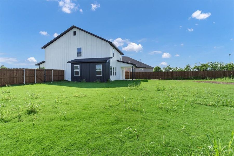 Back of house with board and batten siding