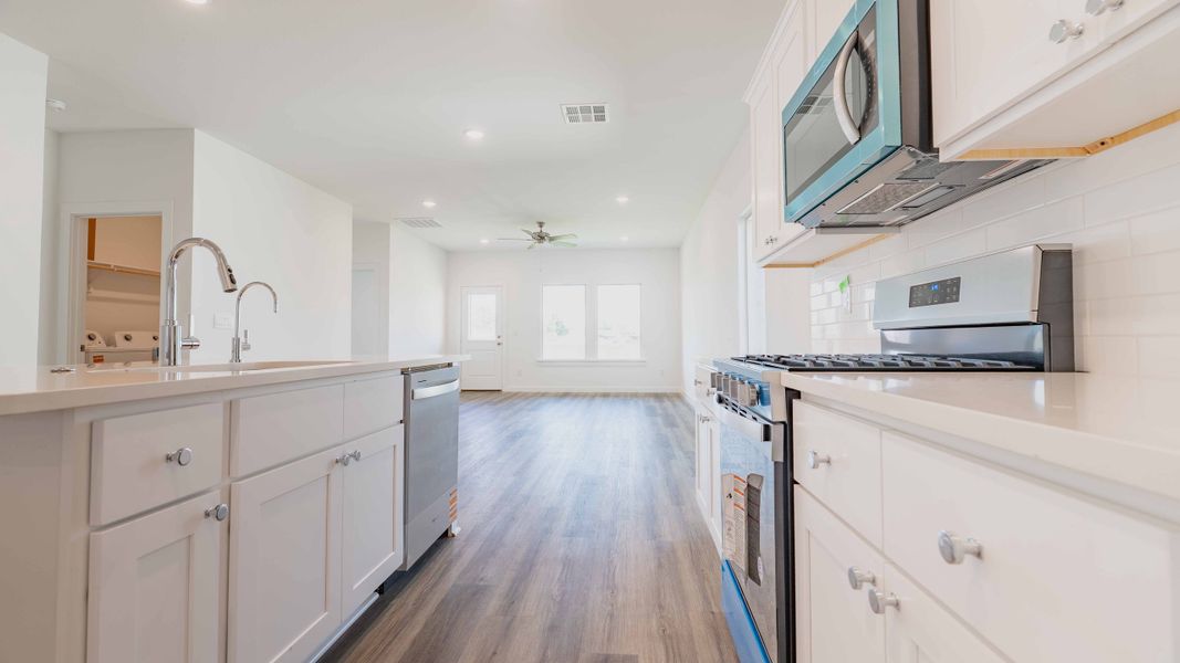 Representative furnished interior of a home built from the The Kendall by D.R. Horton in Overlook West, Wolfforth (Image 4).