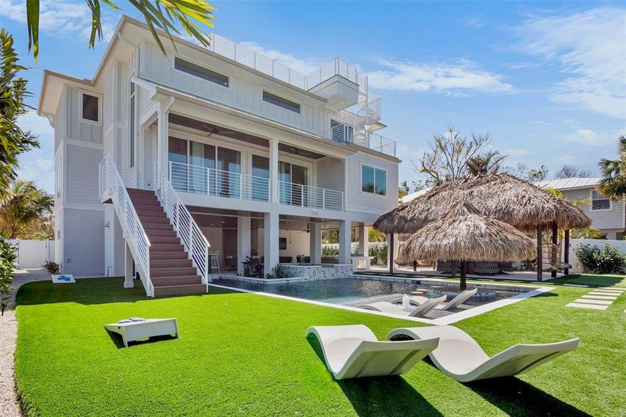Front exterior of a new home in , Anna Maria, FL, highlighting curb appeal (Image 1).