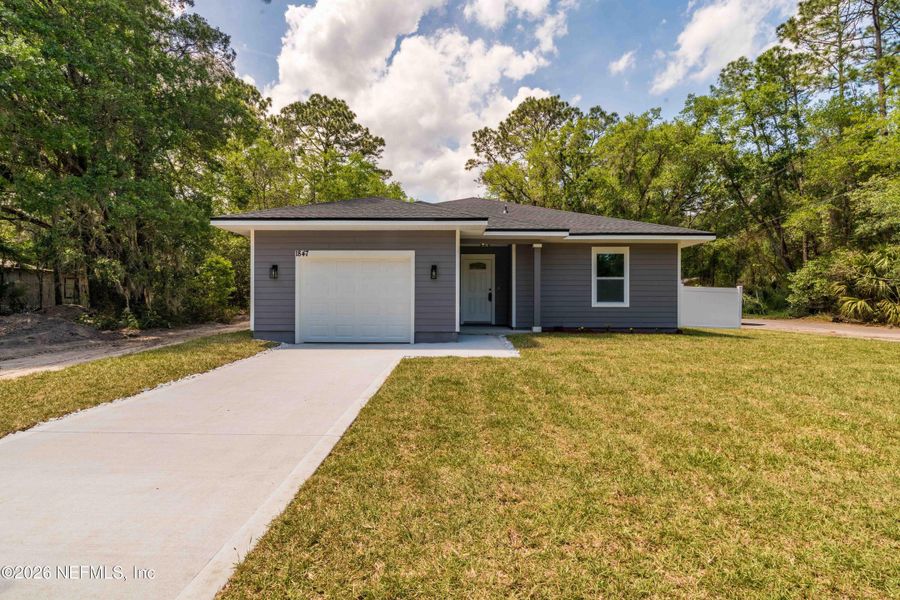 Front exterior of a new home in , Jacksonville, FL, highlighting curb appeal (Image 25).