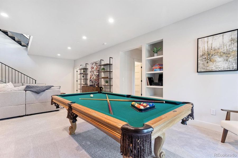 Living area with TV wall and helving - fun game nights are in your future as the pool table with a ping pong tabletop are included Living area with TV wall and helving - fun game nights are in your future as the pool table with a ping pong tabletop are included