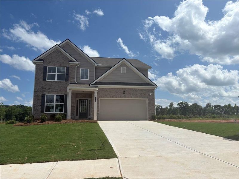 Front exterior of a new home in Highland Park, Stonecrest, GA, highlighting curb appeal (Image 1). Front exterior of a new home in Highland Park, Stonecrest, GA, highlighting curb appeal (Image 1).