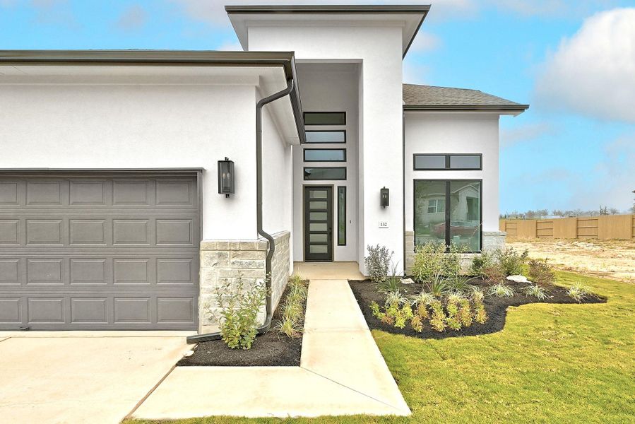 Exterior details and patio area of a home in The Colony, Bastrop (Image 3).