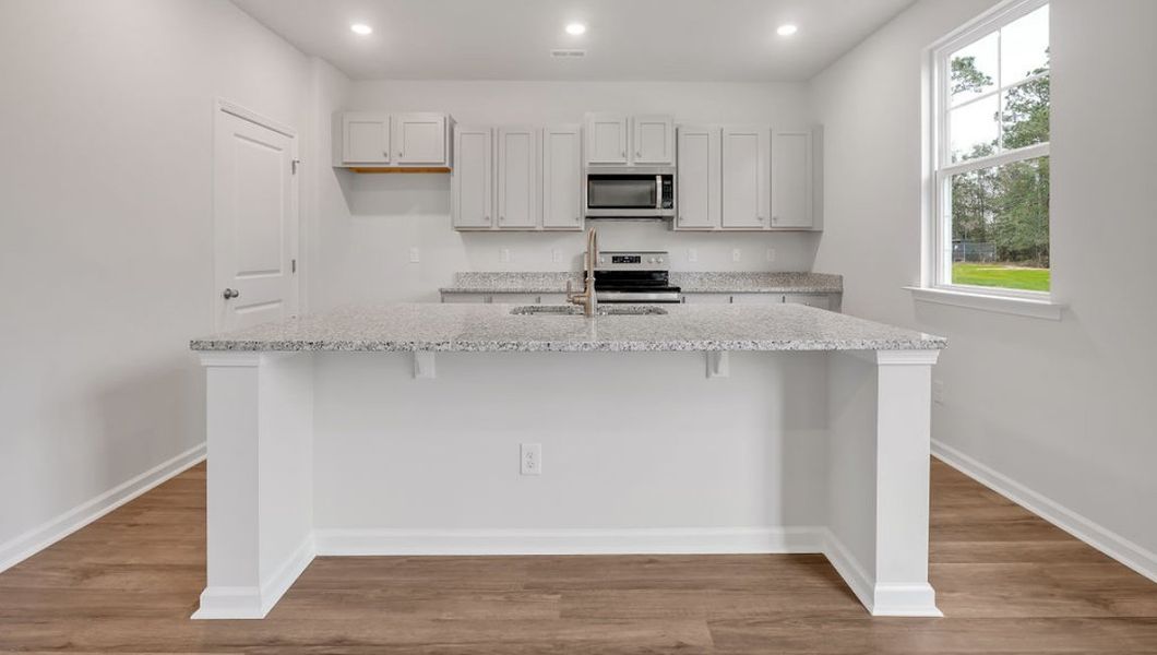 Representative furnished interior of a home built from the GLYNN by D.R. Horton in Grayson Park, Leland (Image 7).