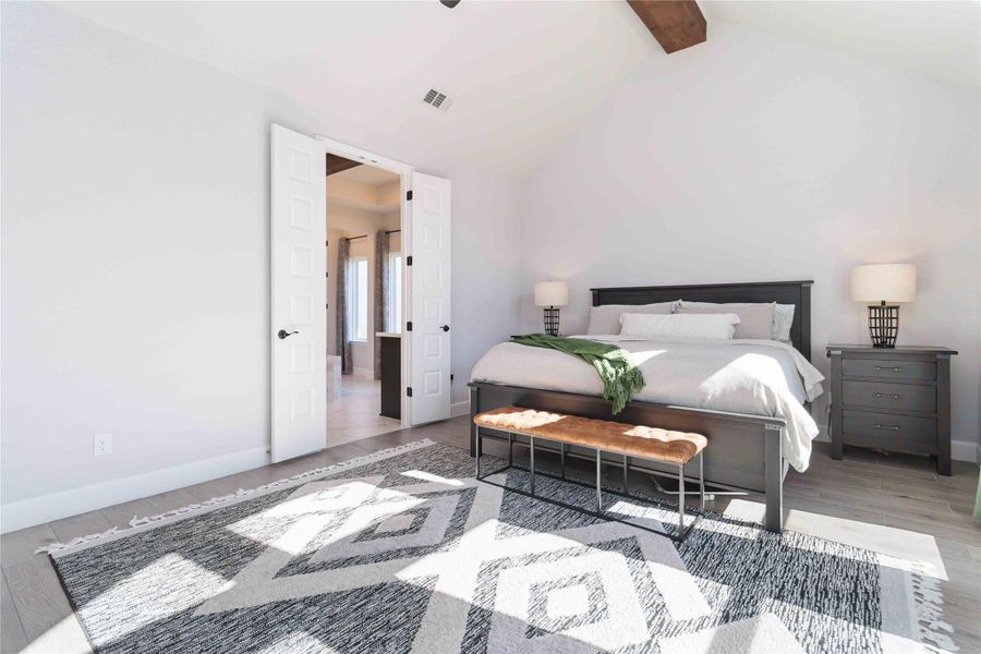 Bedroom with light wood-style flooring and a ceiling fan Bedroom with light wood-style flooring and a ceiling fan