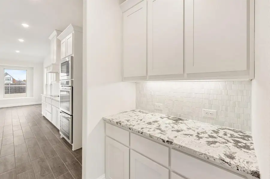 Furnished interior view inside a new home in Sunrise at Garden Valley, Waxahachie (Image 8).