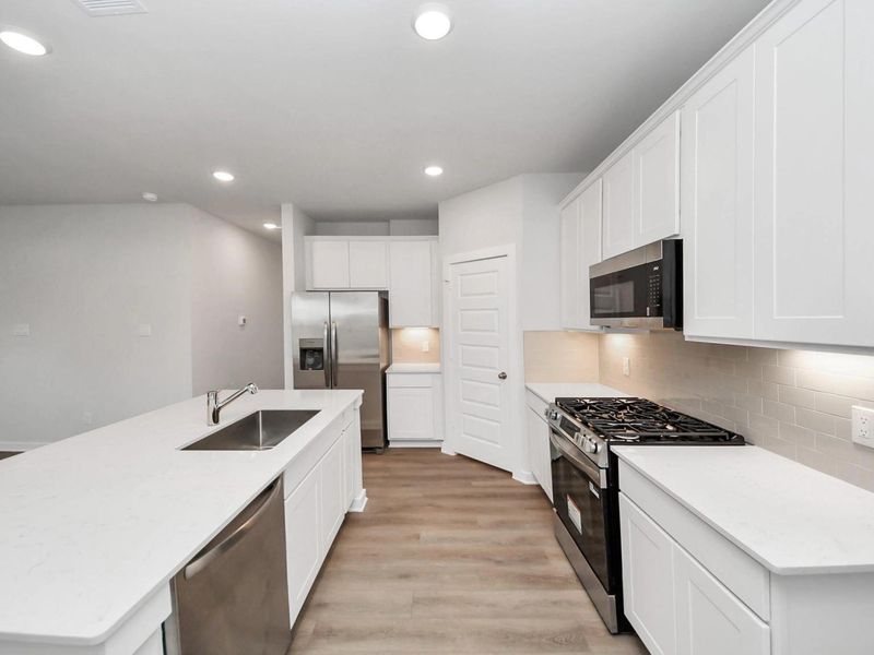 Furnished interior view inside a new home in Caney Creek Place, Conroe (Image 5).