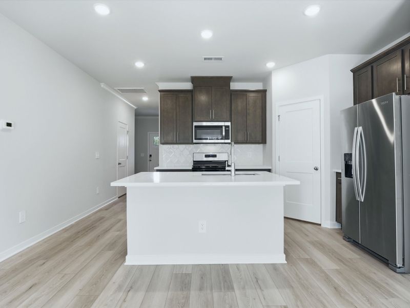 Furnished interior view inside a new home in Oakwood Townes, Mebane (Image 3).
