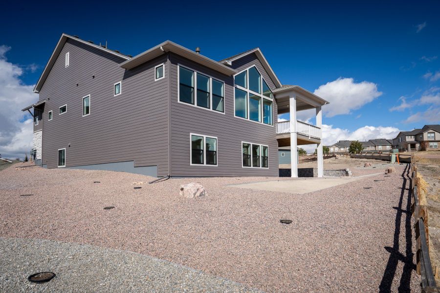 Exterior details and patio area of a home in Cloverleaf - Pinnacle Collection, Monument (Image 3).