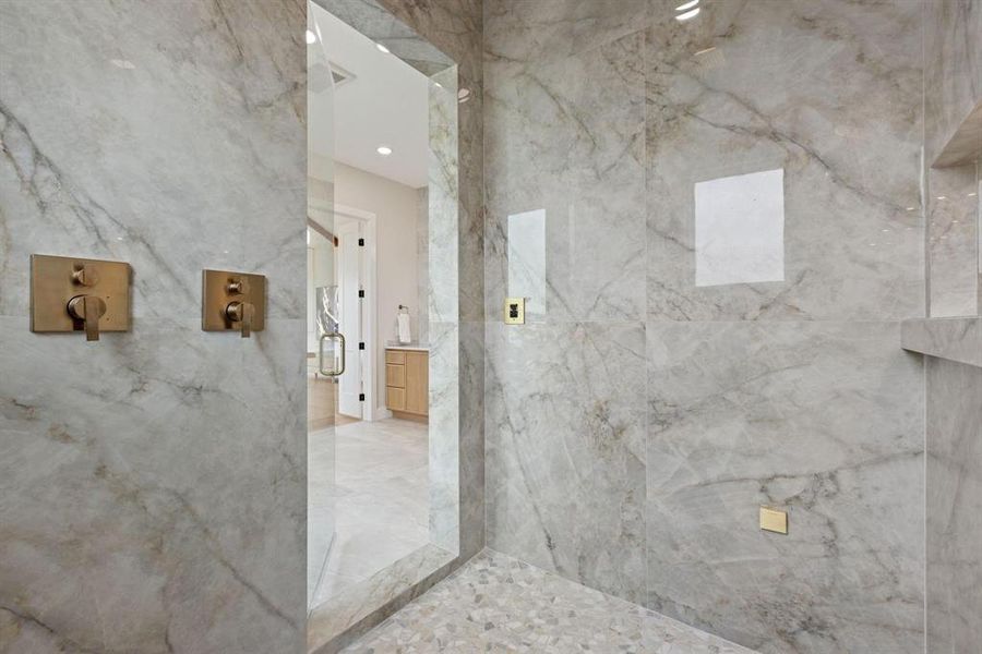 Bathroom featuring a marble finish shower Bathroom featuring a marble finish shower