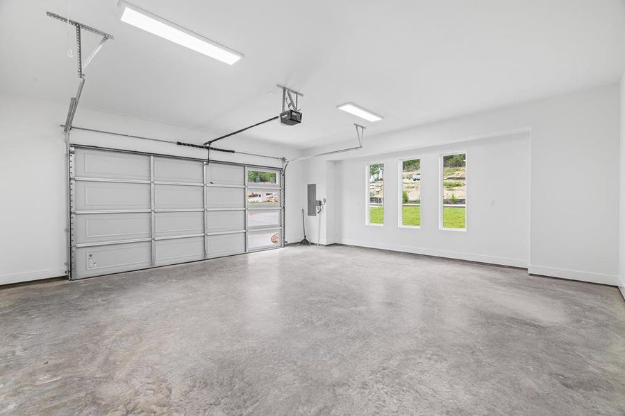 Storage room in oversized garage includes water softener and gas tankless water heater Storage room in oversized garage includes water softener and gas tankless water heater