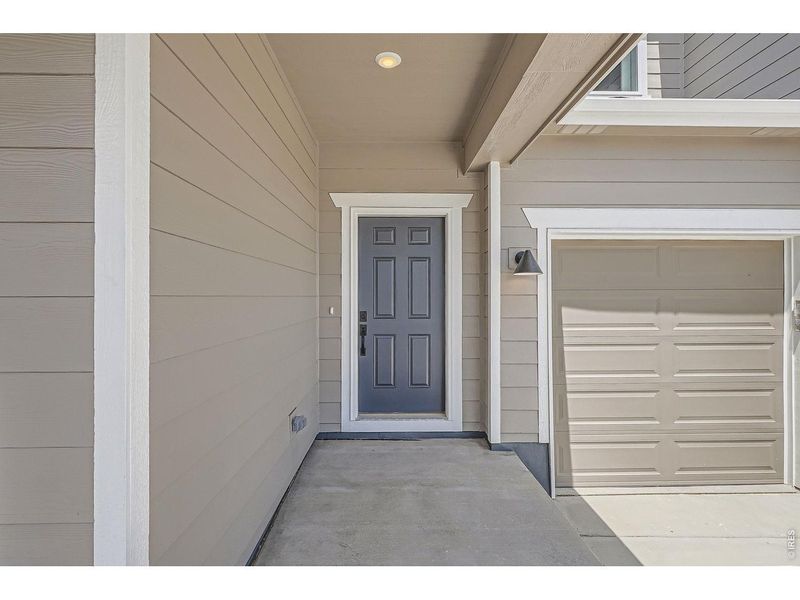 Exterior details and patio area of a home in Farmstead, Berthoud (Image 26).