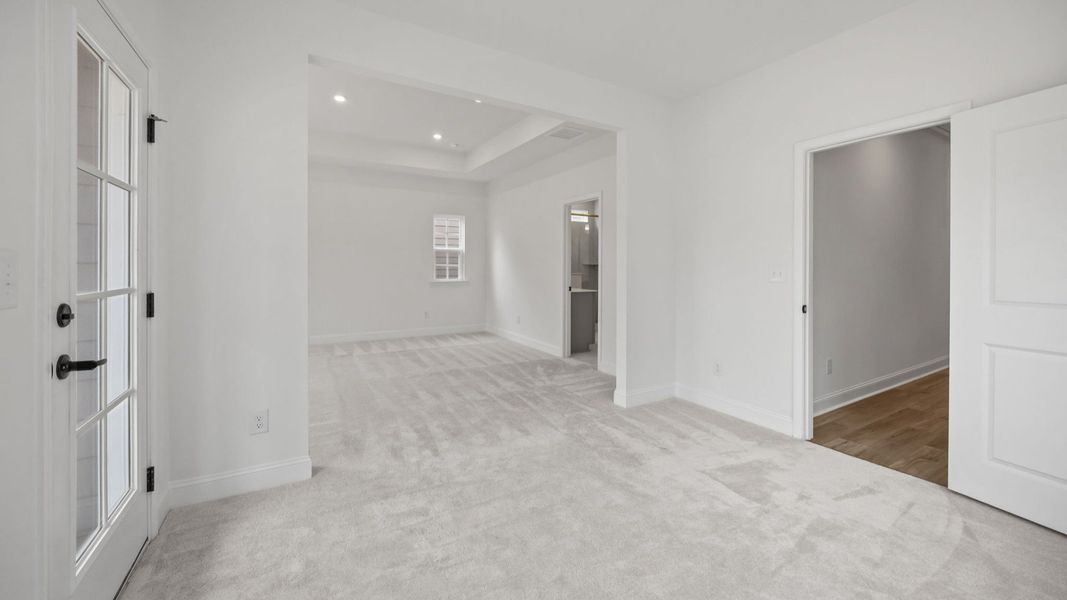 The Brentwood Plan by DRB Homes in River District, Charlotte NC.- Primary Bedroom with Sitting Area The Brentwood Plan by DRB Homes in River District, Charlotte NC.- Primary Bedroom with Sitting Area