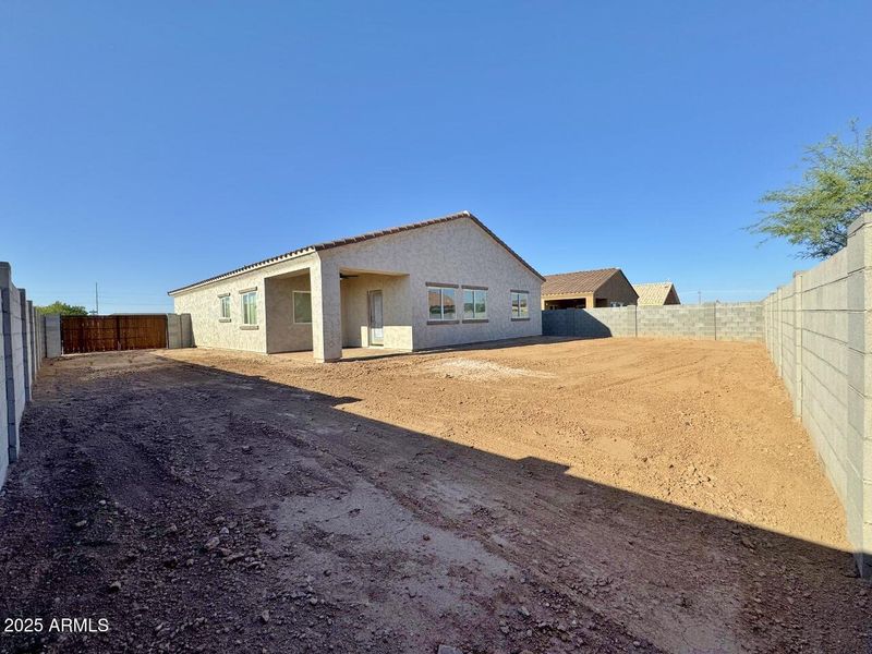 Rear view of home & yard