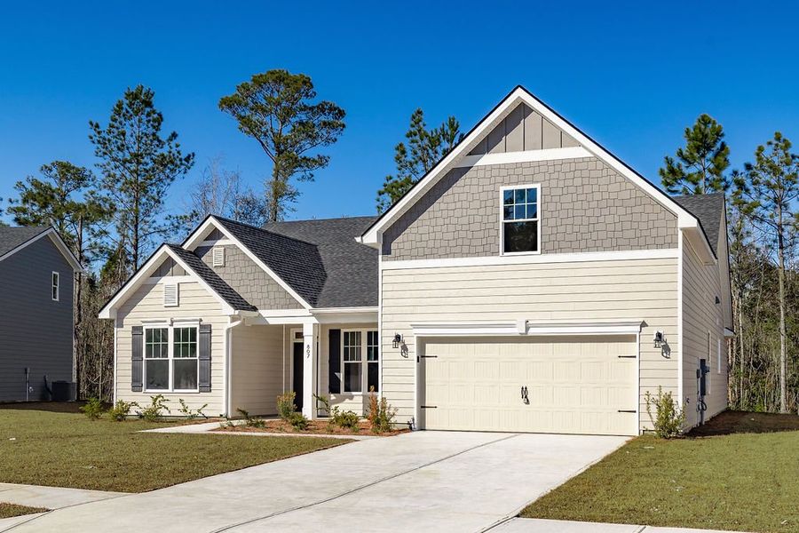 Front exterior of a new home in McAllister Pointe, Richmond Hill, GA, highlighting curb appeal (Image 2). Front exterior of a new home in McAllister Pointe, Richmond Hill, GA, highlighting curb appeal (Image 2).