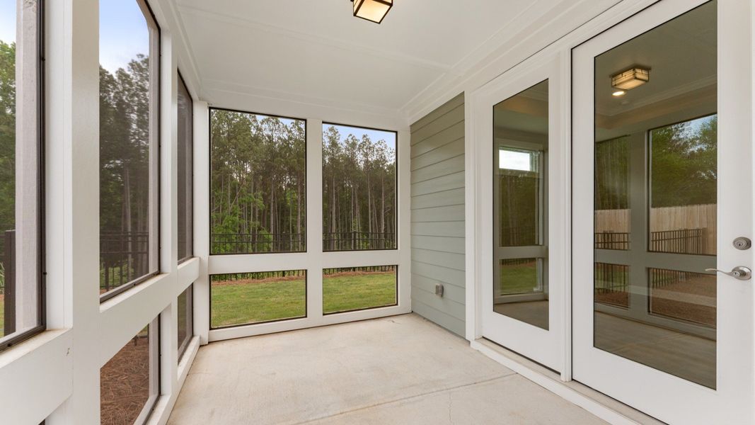 Exterior details and patio area of a home in The Courtyards at Bailey Farms, Dacula (Image 2).