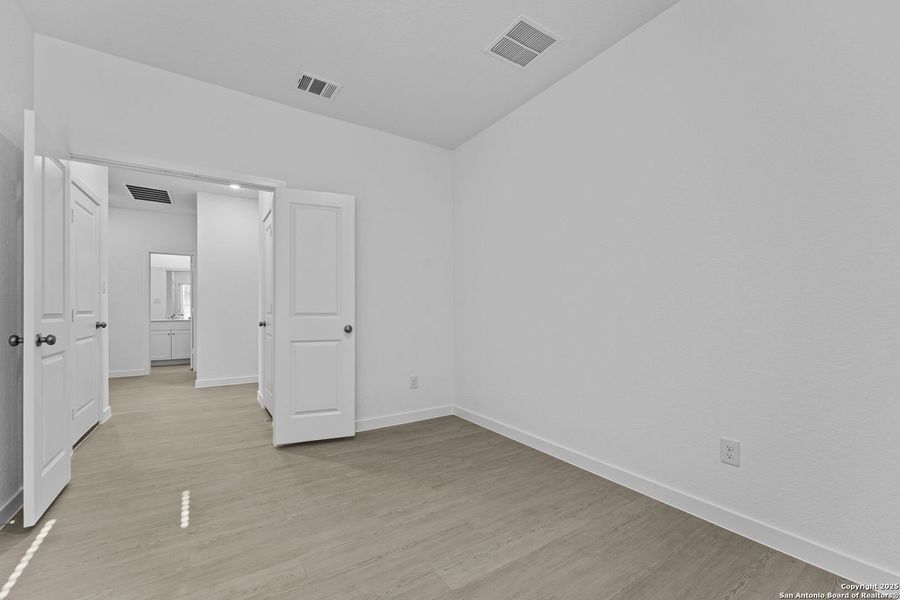 Spacious, unfurnished interior of a new home in Waterwheel: Coastline Collection, San Antonio (Image 26).