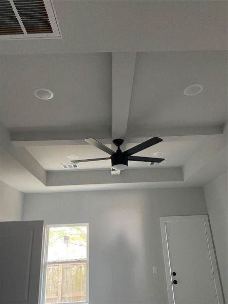 view of the tray ceiling in the primary bedroom