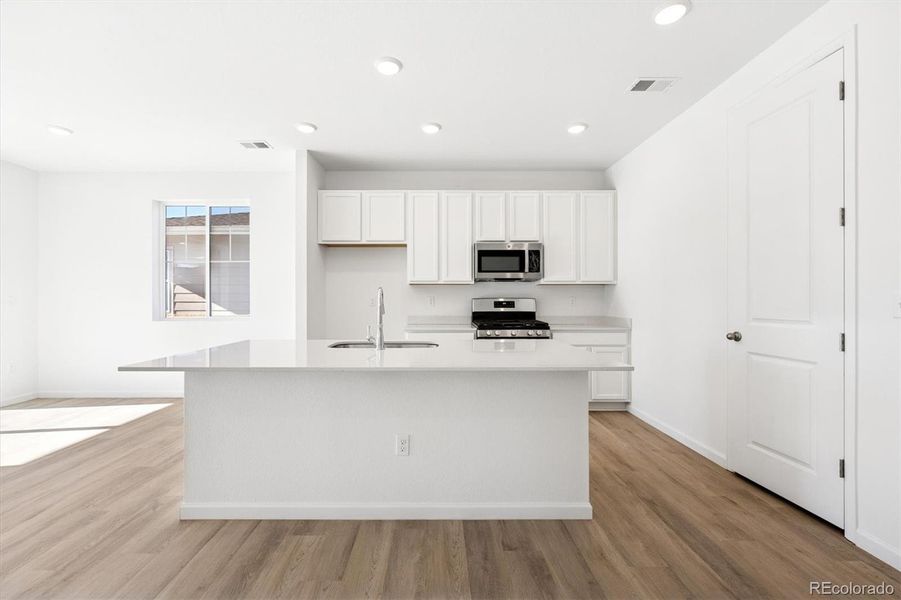 Furnished interior view inside a new home in The Aurora Highlands, Aurora (Image 7).