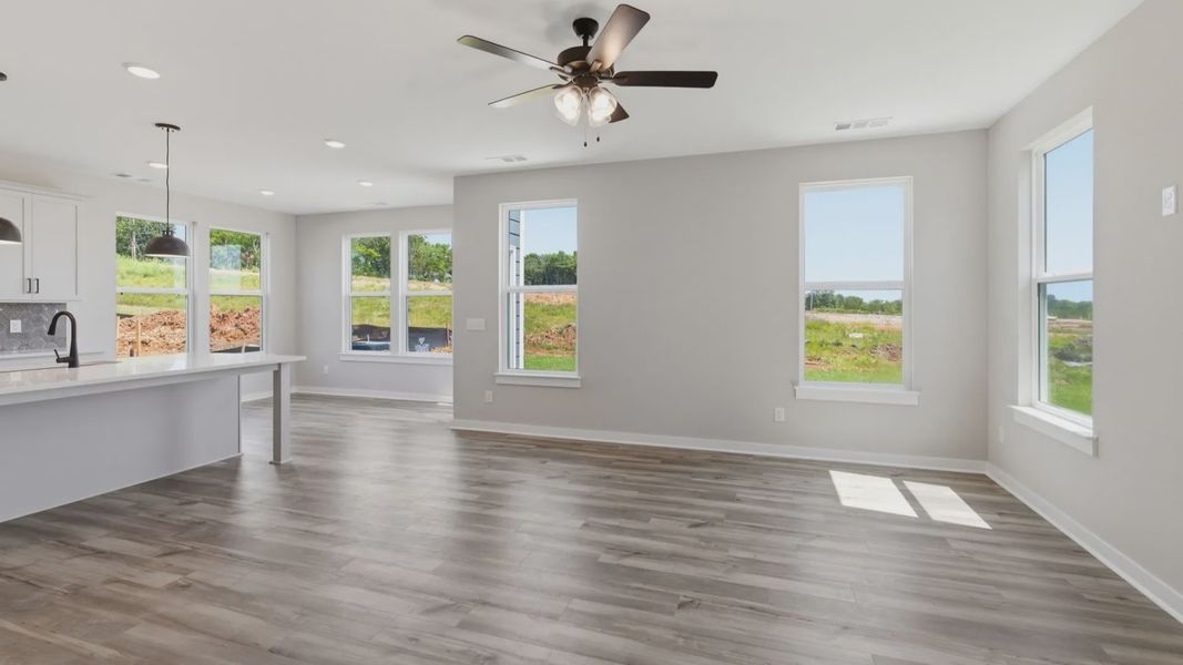 Gathering room with hard surface flooring and ceiling fan