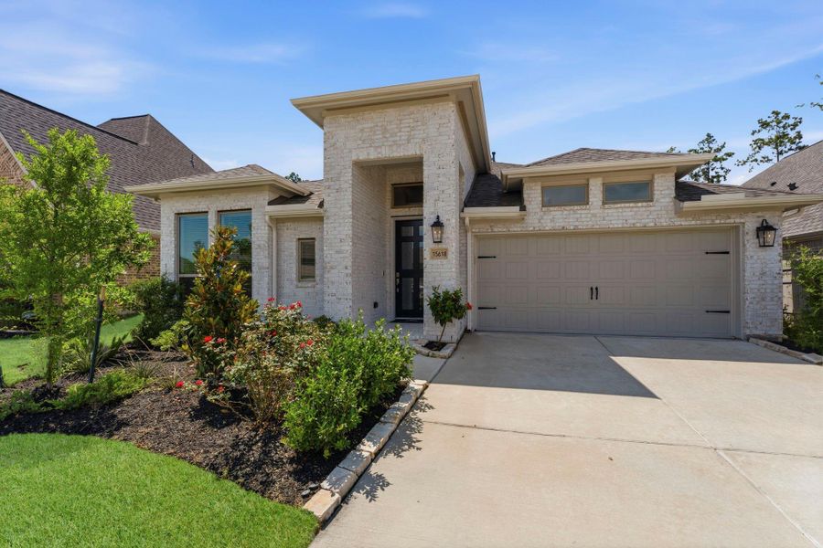 Front exterior of a new home in Artavia, Conroe, TX, highlighting curb appeal (Image 27). Front exterior of a new home in Artavia, Conroe, TX, highlighting curb appeal (Image 27).