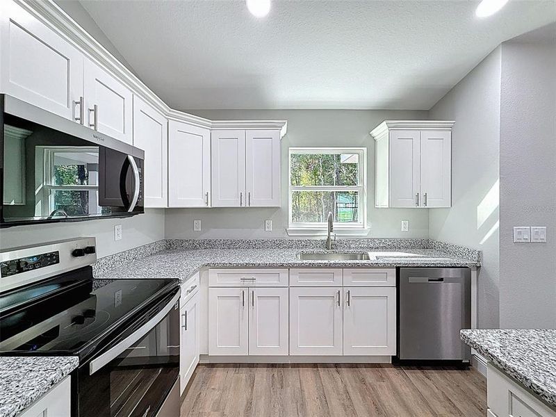 Furnished interior view inside a new home in , Dunnellon (Image 29).