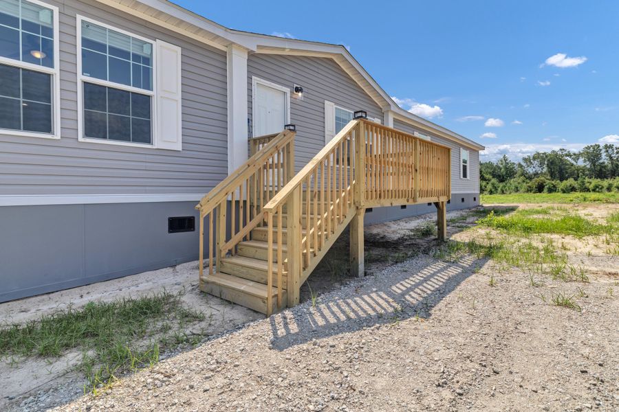 Front exterior of a new home in , Cross, SC, highlighting curb appeal (Image 27).
