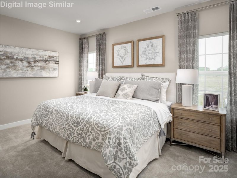 Bright, spacious, and serene — the primary bedroom is filled with natural light and offers plenty of room to relax, recharge, and make it your own. Bright, spacious, and serene — the primary bedroom is filled with natural light and offers plenty of room to relax, recharge, and make it your own.