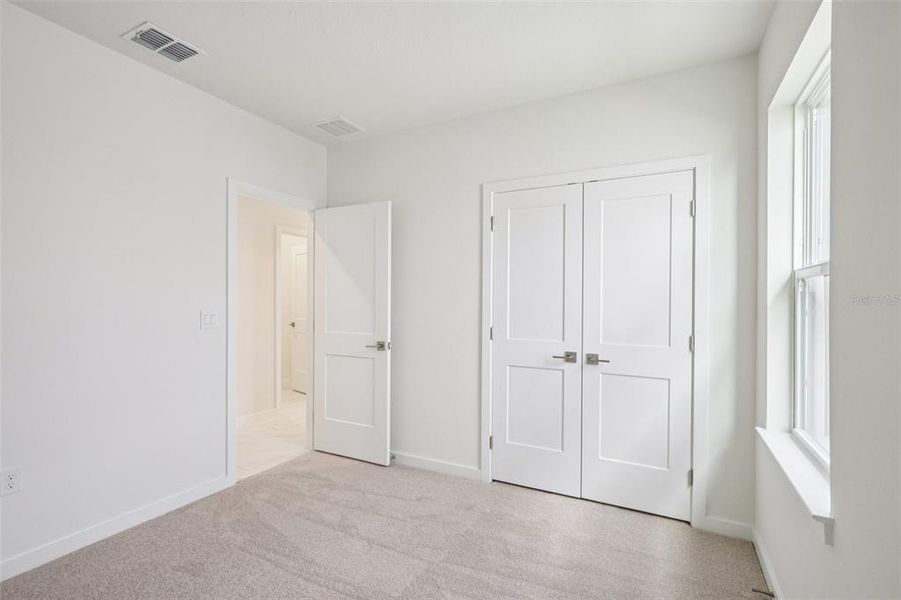 Spacious, unfurnished interior of a new home in Grasslands West, Lakeland (Image 25).