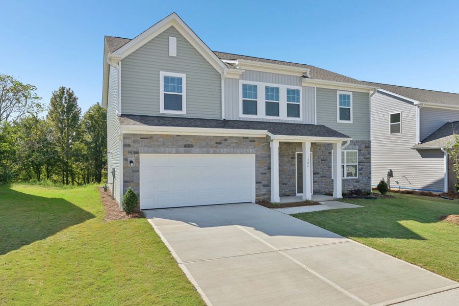 Front exterior of a new home in The Meadows, Mebane, NC, highlighting curb appeal (Image 1). Front exterior of a new home in The Meadows, Mebane, NC, highlighting curb appeal (Image 1).