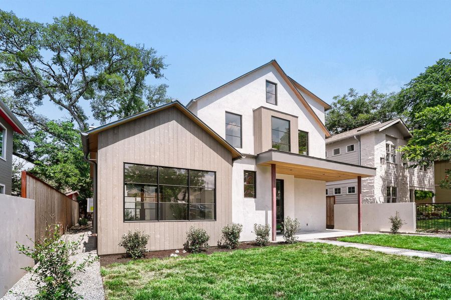 Modern architecture with clean lines and large windows defines this inviting facade, offering a welcoming presence.